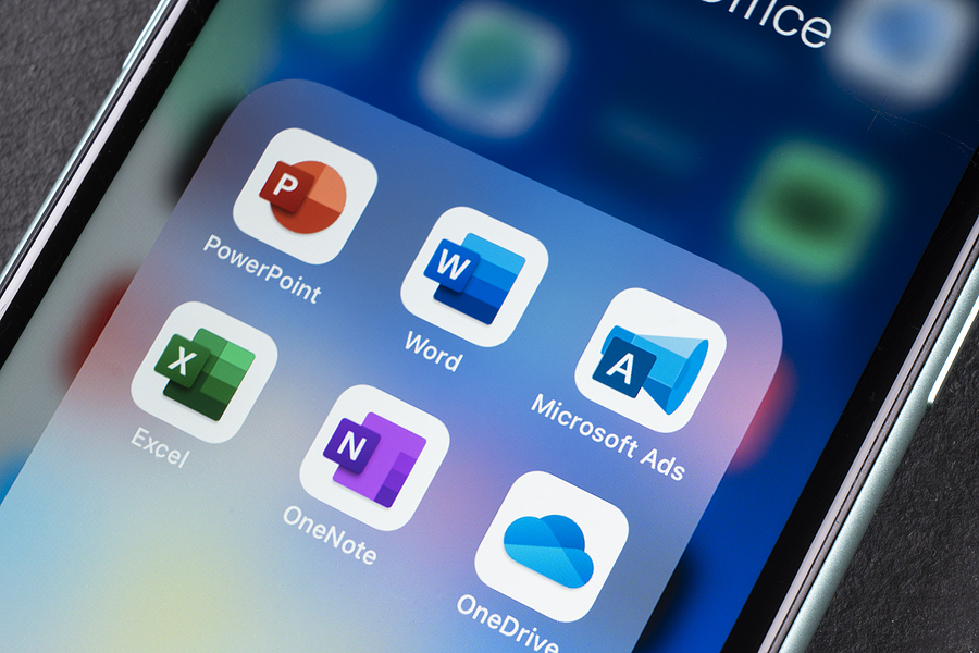 Close-up of Apple iPhone 11 screen that shows icons for Microsoft Word, Excel, PowerPoint, Onedrive, Ads, and OneNote.